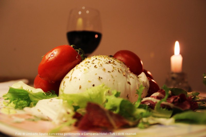 Buffalo Mozzarella with Pachino baby tomatoes on a bed of mixed salad